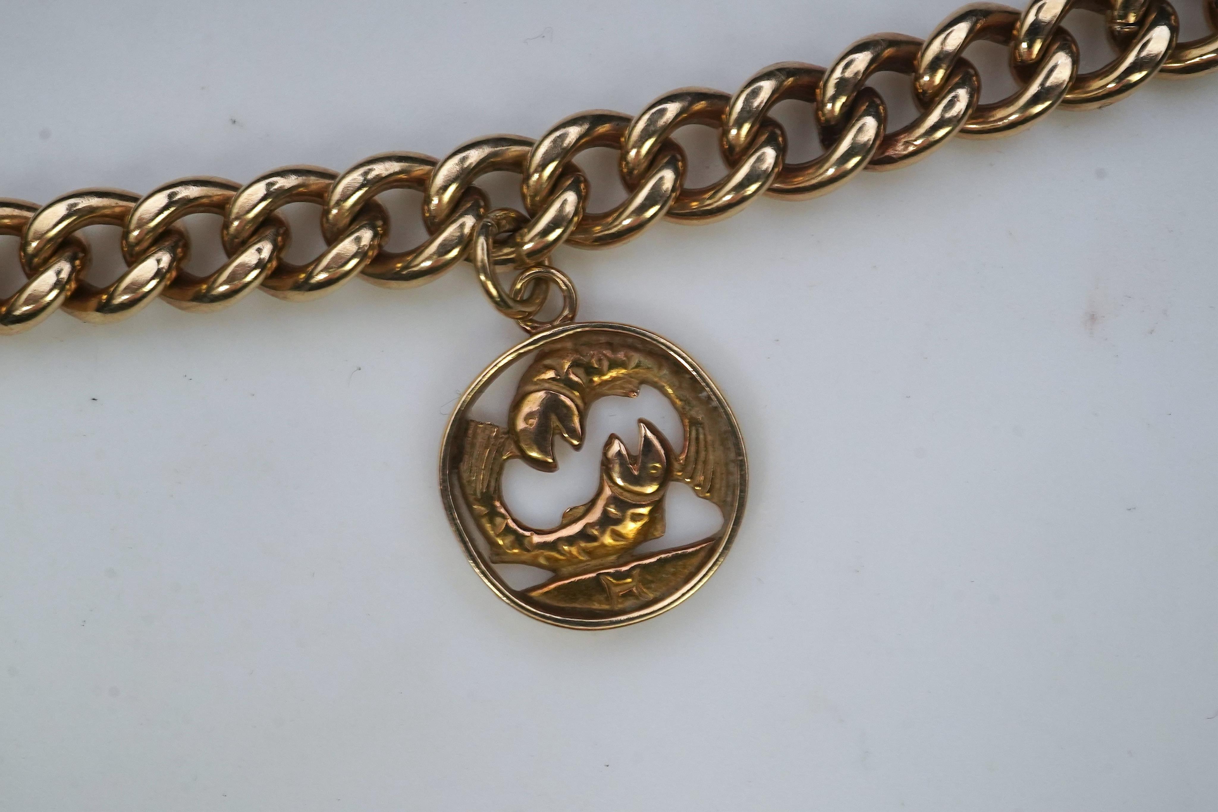 A 9ct gold charm bracelet, circa 1997